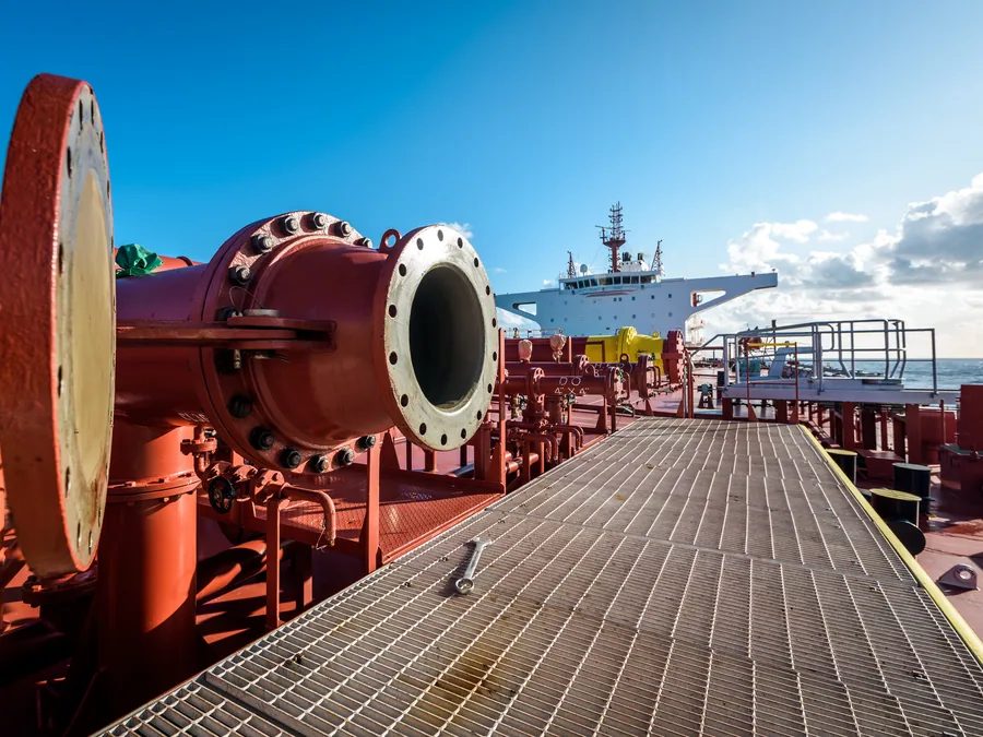 Deck pipework with a dismantled cargo line flange during a repair project on board.