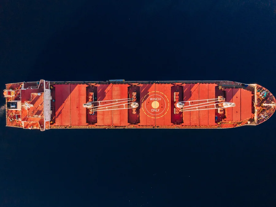 Aerial view of a bulk carrier's cargo holds and hatch covers.