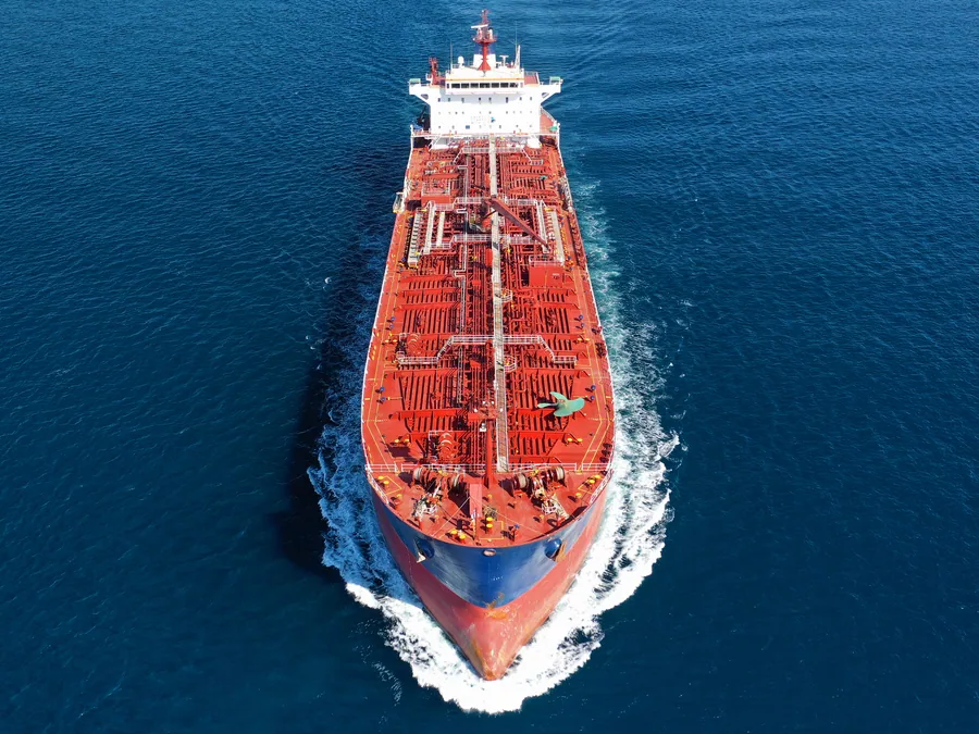 Product tanker under way at sea, seen from ahead.